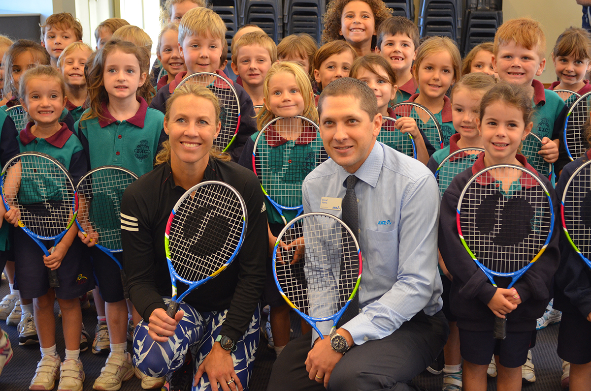 Alicia Molik and David Harris (ANZ) presenting Kindergarten with their racquets