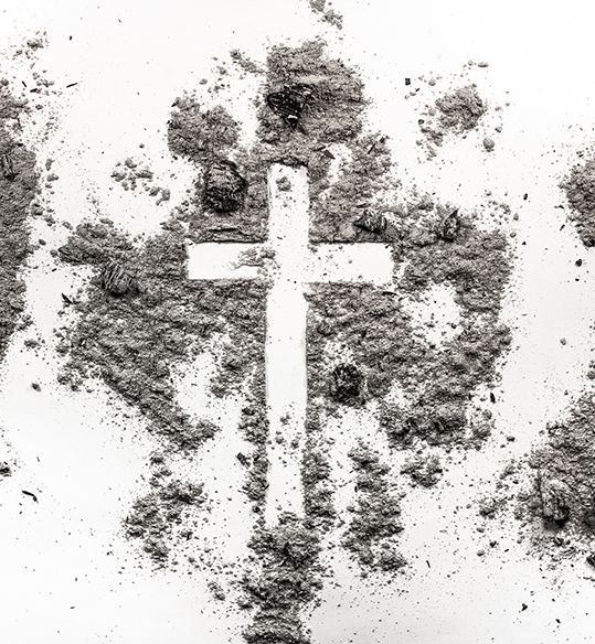 Christian cross crucifix symbol sign made in ash dust. Ash Wednesday concept